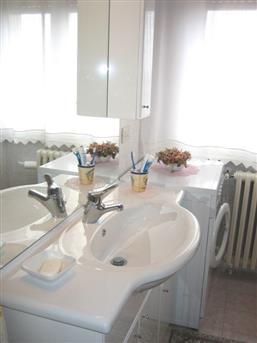 bathroom with shower and washing machine